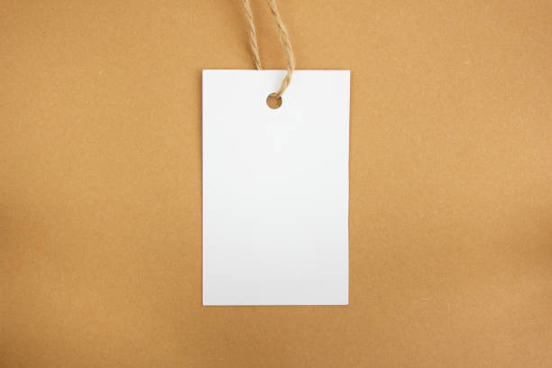istock White price tag on a brown background. Mockup. Place for text. 1408265051