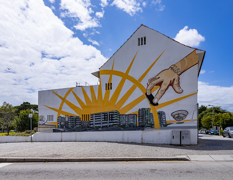 Matosinhos, Portugal - June 25, 2022: A picture of a mural depicting the Matosinhos seafront lit by the sun.