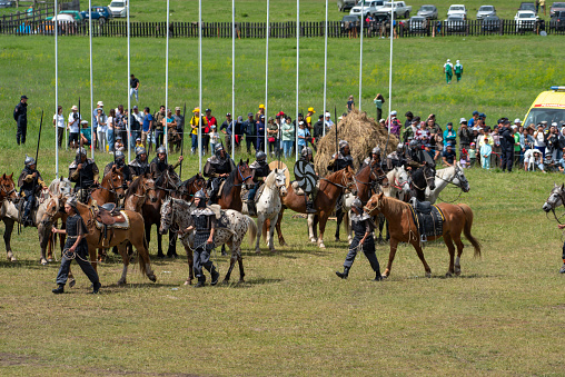 Ust-Kan. Russia. July 09, 2022. Ancient warriors on horseback are participants in a costumed performance at the most important national holiday of the Altai Republic, El Oyin (\