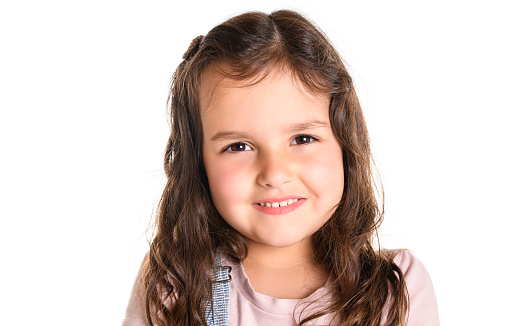 A Cute girl 4-5 year old posing in studio white background