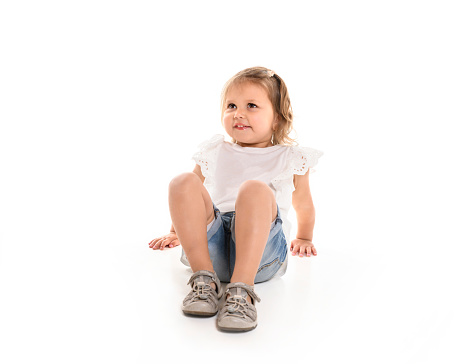 A cute toddler girl two years isolated on white background