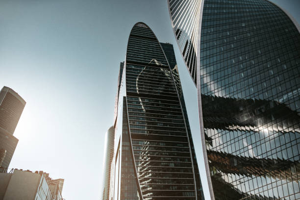 istock Modern skyscrapers against clear sky and glowing sun 1408270629