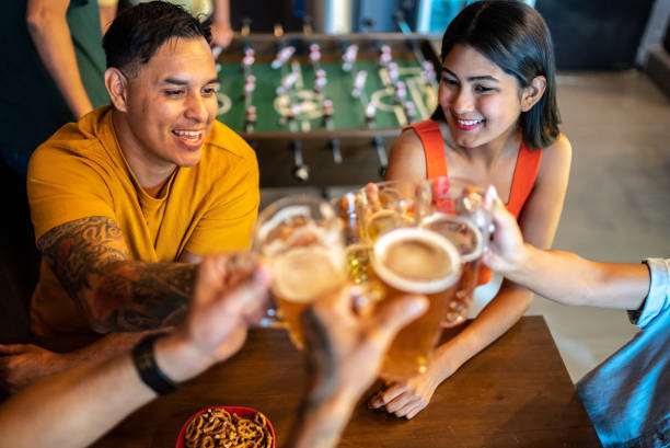 istock Friends celebrating and doing a celebratory toast at bar 1408277437