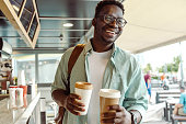 istock African-American student picking up a coffee 1408278705
