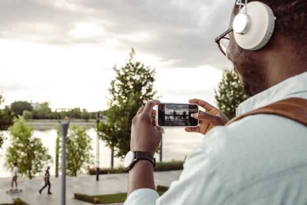 Young African-American man taking a picture