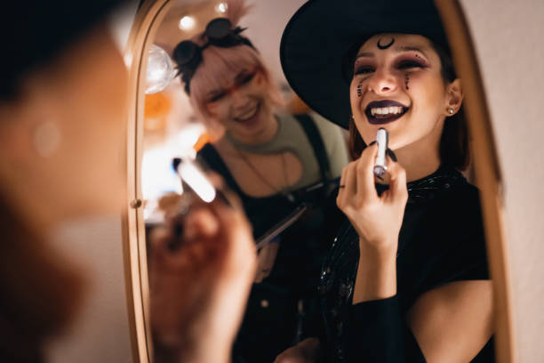 istock Girlfriends doing make-up for Halloween party 1408278882
