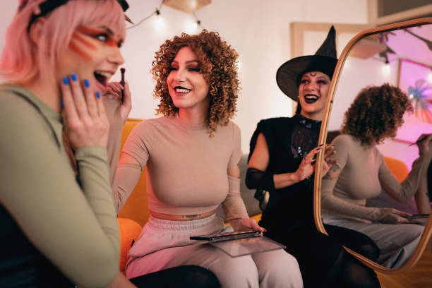 istock Girlfriends doing make-up for Halloween party 1408278943