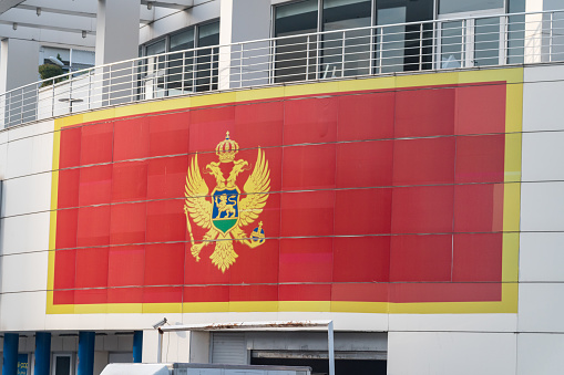 Podgorica, Montenegro - June 4, 2022: The flag of Montenegro on Mall of Montenegro.