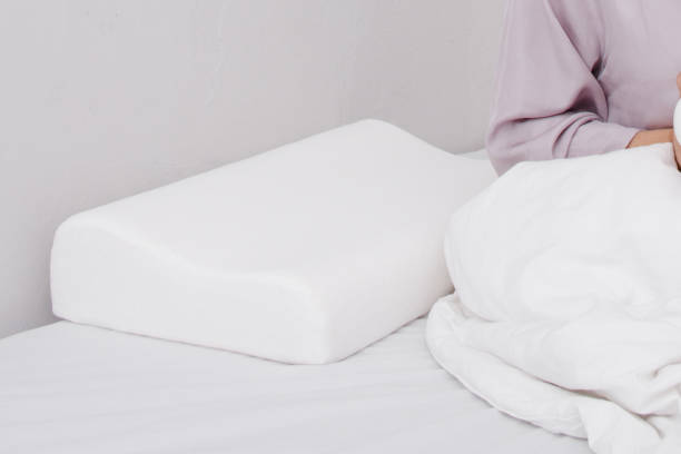 Orthopedic Pillow with a Memory Effect. Medical treatment pillow for sleep. Comfort Memory Pillow under the head with a recess under the shoulder isolated on white background. Sleeping Support Pillow