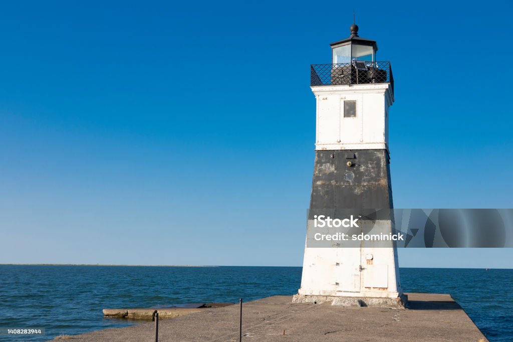 North Pier Light Erie Pennsylvania North Pier Light in Presque Isle State Part in Erie, Pennsylvania, USA. Lighthouse Stock Photo