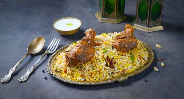 istock Lamb Shank Biryani with raita served in a dish side view on dark background 1408284906