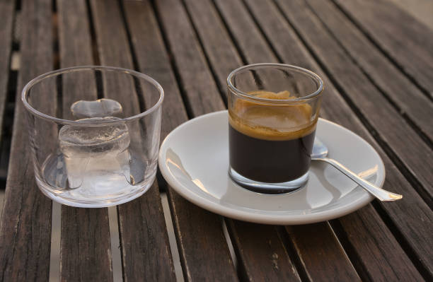 istock Espresso coffee with ice on a wooden table. 1408284909