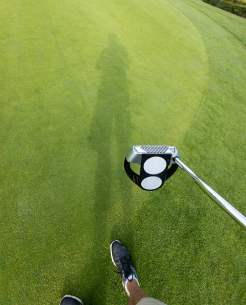 istock The shadow of the golfer 1408289146