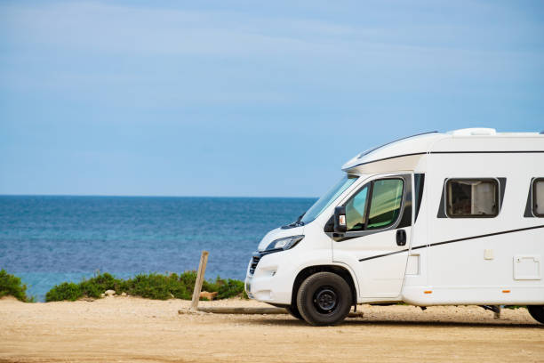 istock Camper on beach seashore. Holidays trip. 1408290461