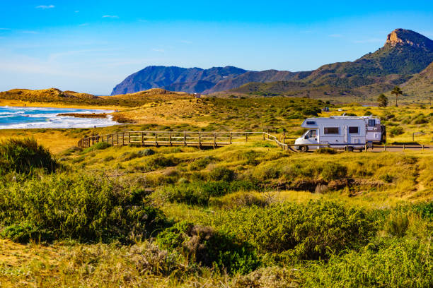istock Camper rv camping on sea shore, Spain 1408291417