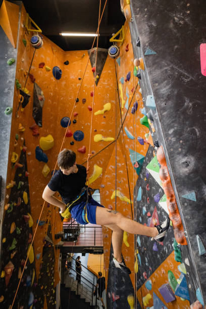 istock The man climbing on the climbing wall 1408294876