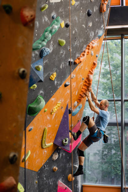 istock The man climbing on the climbing wall 1408294889