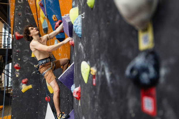 istock The man climbing on the climbing wall 1408294898