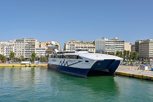 Athens, Greece - May 2022: Twin hull high speed ferry World Champion Jet moored  in the port of Piraeus after arriving from one of the Greek Islands. The ferry is operated by Seajets.