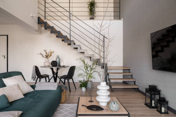 istock Living room with table and staircase 1408296727