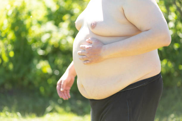 istock A fat man with a big belly 1408296762