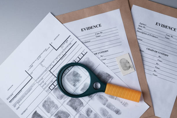 istock Fingerprint card, magnifying glass on  background of evidence packaging, forensic fingerprint analysis 1408297838