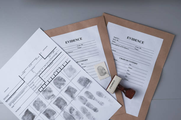 istock Fingerprint card and paper envelopes for packaging evidence on a gray background, forensic fingerprinting 1408297847
