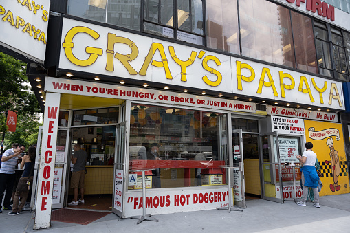 New York, NY, USA - June 3, 2022: The Gray's Papaya hot dog restaurant on the Upper West Side of Manhattan.