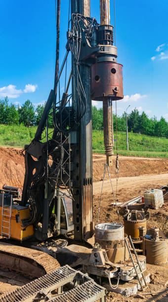 istock machine for drilling deep piles is preparing to work on the construction of the bridge 1408299824