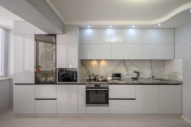 istock Interior of modern trendy white kitchen, front view 1408301319
