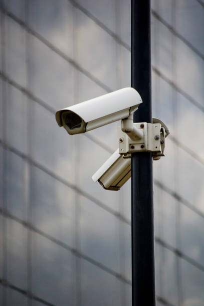 istock City monitoring system camera against building wall. 1408301338