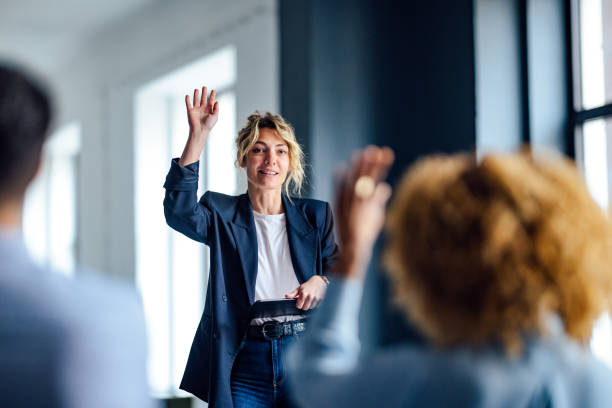 istock Cheerful Female Presenter Interacting With the Audience 1408304025