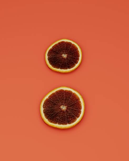 istock Two slices of graipfruit on orange background from top view, 3d rendering 1408307409