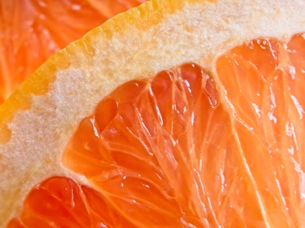 istock A wholesome slice of ruby red grapefruit, a vegan food packed with vitamin C 1408307742