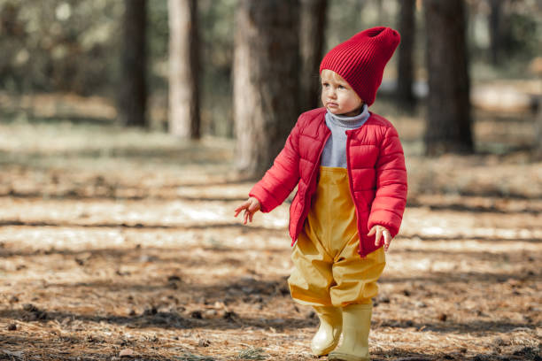 istock Little girl walking in the forest 1408309727