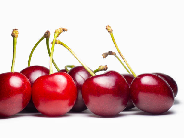 istock Juicy cherries on a white background. Useful food. Beautiful berries isolate. Ripe berries on the table. 1408312951