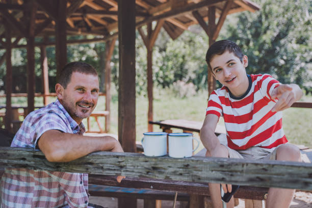 istock Father and son hiking together. 1408314926