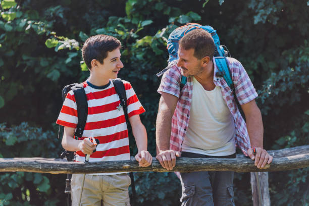 istock Father and son hiking together. 1408314929