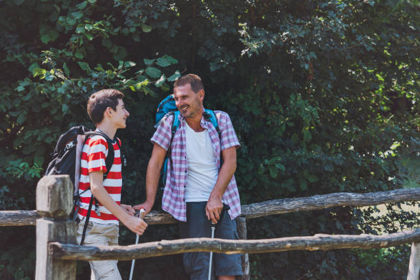 istock Father and son hiking together. 1408314930