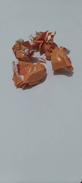 istock orange crumpled paper, scattered 1408315907