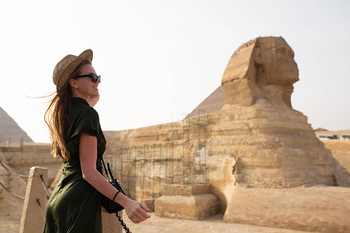 A trip to remember. A young woman in front of the Sphynx.