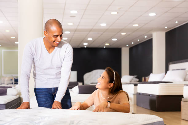 istock Seller talking with customer about chosen mattress 1408317776