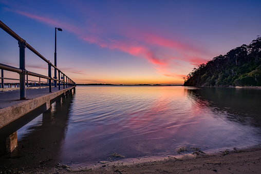 Sun going down at Kalimna jetty in East Gippsland Victoria