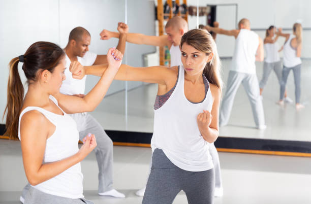 istock Womens sparring in self defense courses in gym 1408318022