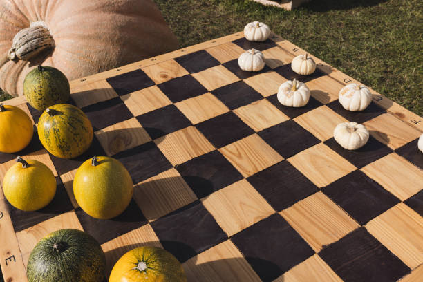 istock Halloween pumpkins on chess board, fall decoration 1408321848
