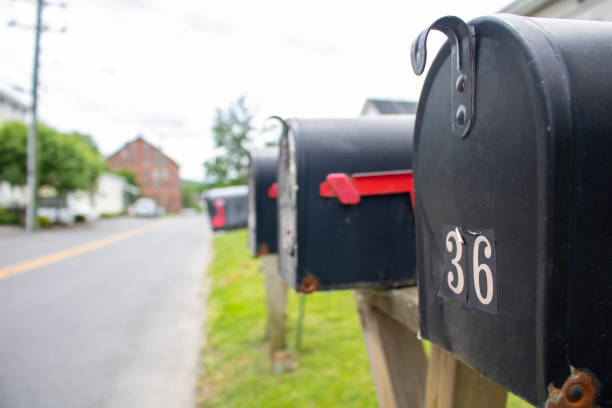 istock line of street-side residential mailboxes in perspective 1408323746