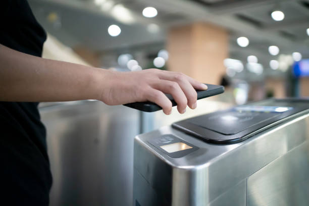 istock Man paying for subway with mobile phone 1408324083