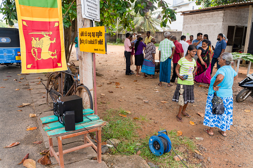 Siddanakolla, Karnataka, India - November 7, 2013: Democracy at work: village meeting to solve farmer dispute. Mayor explains his coming decision.