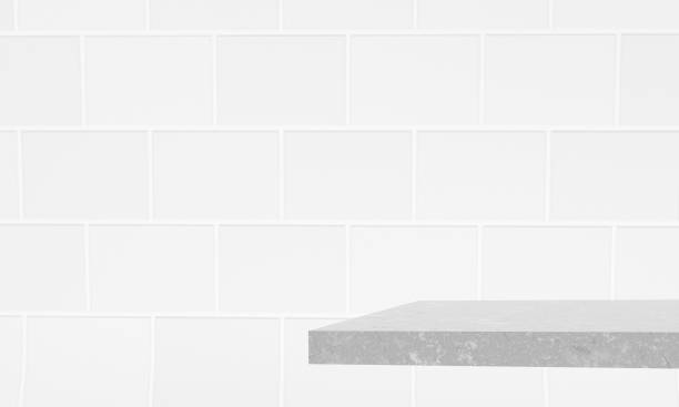 istock 3d render. Abstract gray background. Mock-up of a tiled wall and a stone countertop. 3d illustration 1408326674
