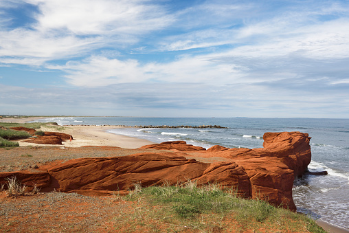 Red rocks and sandy beach at sunset in Francois Peron National Park Western Australia
